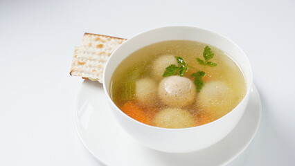 Jewish chicken broth with kneidlach (balls made with matzo meal)Matzo ball soup