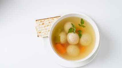 Jewish chicken broth with kneidlach (balls made with matzo meal)Matzo ball soup