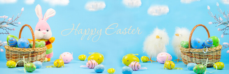 Easter. Happy Easter card with traditional Easter eggs in a basket and a rabbit. Lettering Happy Easter. Chickens. Banner. copy space