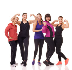 Fitness 101: Get great gym buddies. A group of excited women of different body shapes standing...