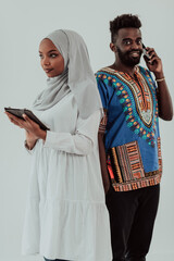Young african business team woman wearing traditional sudan muslim hijab clothes using tablet...
