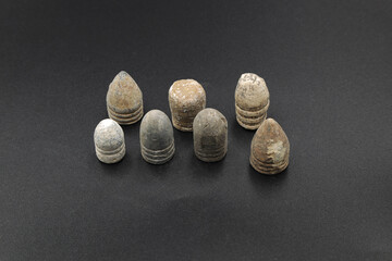 Antique lead bullets on black background