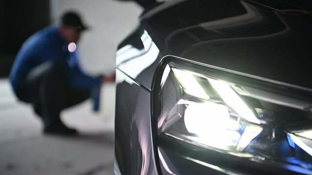 Vehicle Detailing Service Worker Taking Care of a Car