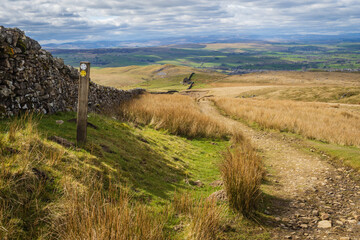 Walking the Nine Standards Rigg on the Coast to Coast walk in the North Pennines near to Kirkby stephen