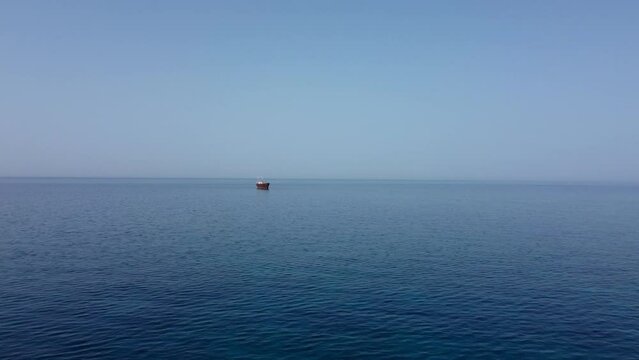 Fly over mediterranean sea with abandoned ship. Shipwreck of MV Demetrios II. Ship near seashore of Chloraka, Cyprus.