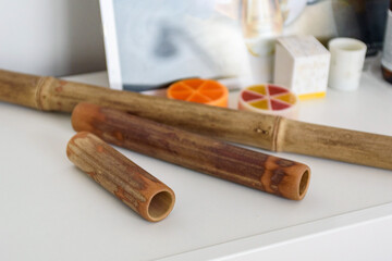Closeup of bamboo massage sticks on shelf in massage salon