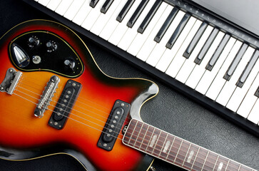 Fototapeta na wymiar Synthesizer keyboard, violin and electric guitar.