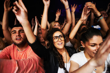 These girls love their music. Attractive female fans enjoying a concert- This concert was created...