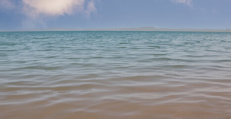Background from water and sky. Water texture with copy space.