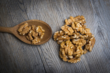 Walnuts on a wooden spoon