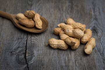 Pile of monkey nuts on a wooden spoon