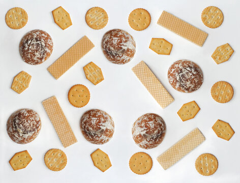 Dessert collection of cookies. Honey gingerbreads covered with icing sugar, crackers, waffles isolated on white background . Free copy space.Top view.