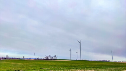 Electric wind turbine generating with blue sky and turbo generator