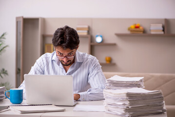 Young businessman employee working from home during pandemic