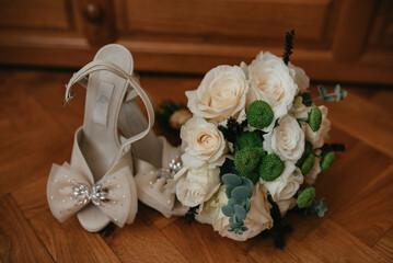 Wedding details. High heels, bouqet, parfume. For her special day.