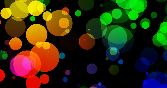 Abstract dark background with big colorful light bokeh circles.