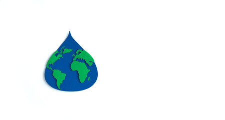Paper cutout water drop with world map inside on white background. Copy space. Earth day. International Earth Day.