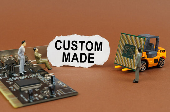 On a brown background, a loader, a processor, figures of people and paper with the inscription - custom made