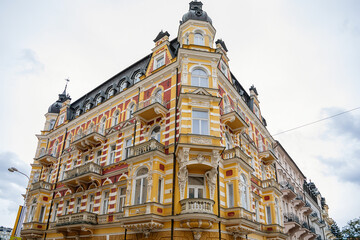 Obraz premium Marianske lazne, Czech Republic, 7 August 2021: Romantic architecture of Bohemia, spa city Marienbad, colorful houses with beautiful facades of wellness hotel at sunny summer day, cultural monument