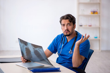 Young male doctor radiologist working in the clinic