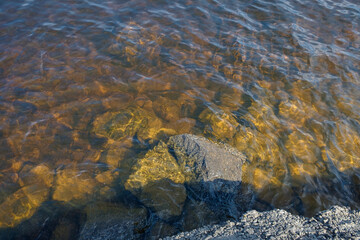 Bank of the Dnieper River. Waves hit the rocky shore