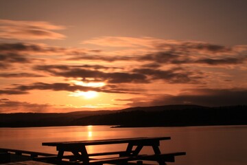Fototapeta premium bench against the sunset - Fornebu