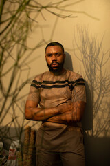 Portrait of young black environmentalist folding his arms