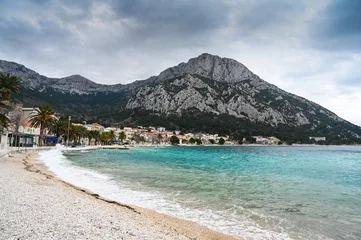 Foto op Canvas Waves on the sea at winter. Gradac, Croatia. Adriatic Sea at cloudy day. © Ajdin Kamber