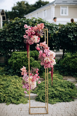 Floral decorations at the wedding ceremony. Pink flowers
