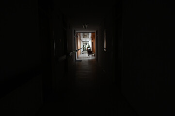 Long dark hallway in building. Empty school passage.  