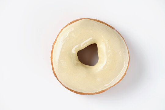 donut covered with colored icing on a white background