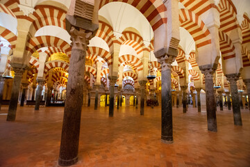Medieval moorish architecture, colorful achways with columns in old mosque in Cordoba with no...