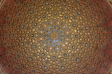 View on Mudejar style architectural details of ceiling in royal palace.. Old historical Andalusian...