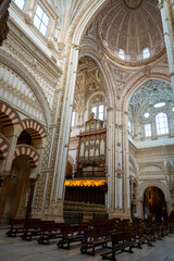 Fototapeta premium Medieval moorish architecture, colorful walls with ornament in old mosque in Cordoba with no people, Andalusia, Spain