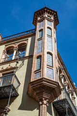 Colorful old historical Andalusian town Seville, Spain. View on architectural details of houses in central part of town.