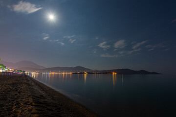 beach parasols at night with lights