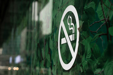 No smoking sign printed on a glass surface. High quality photo