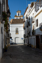 Fototapeta na wymiar View on old part of Cordoba, San Basilio quarter with white houses and flowers pots