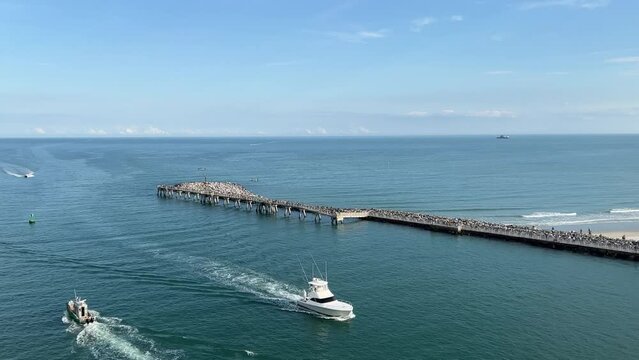 A fishing boat going by a cruise ship out of Port Canaveral, FL.