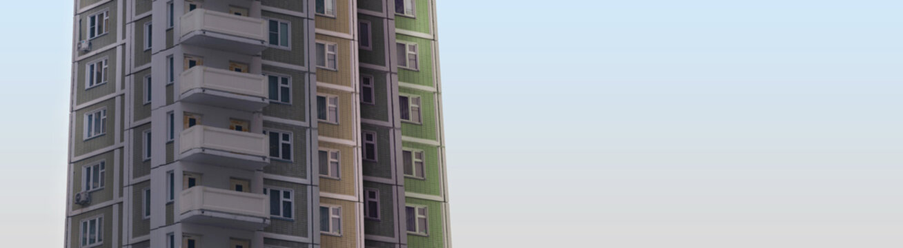 The high apartment buildings set with balconies and windows on the light field of clean sky behind in perspective view