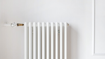 Radiator of the central heating system installing on wall