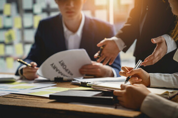 Teamwork with businesspeople analysis cost graph, Business Corporate brainstorming, Planning Strategy having a discussion Analysis investment researching with the chart at office