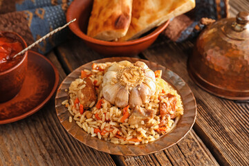 Plate of traditional pilaf on table