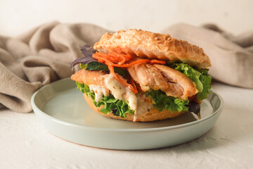 Plate with fresh doner kebab in bun on white background