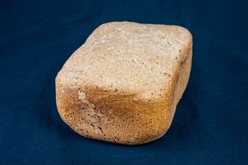 The freshly baked bread on a black background close-up. Making bread.