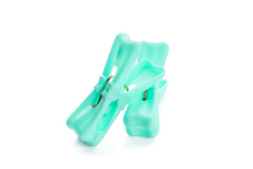 Plastic clothes pins on white background
