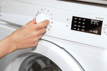 Washing machine.Horizontal view of turning on the washing machine
