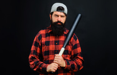 Bearded man with baseball bat. Sport, training, healthy lifestyle. Professional baseball player in cap.