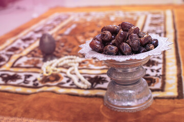 Dried Dates in a Silver bowl