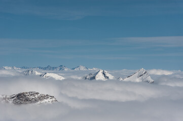 Fototapeta na wymiar Snowy winter mountains in sun day. Georgia, from ski resort Gudauri.